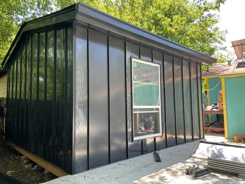 Black standing seam metal wall panels for Roof Inspection in Fridley