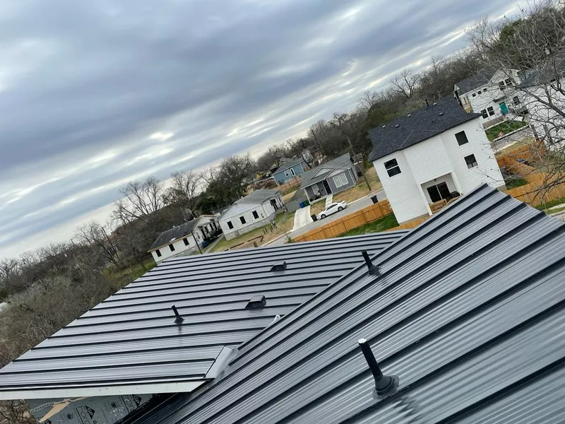 Standing seam metal roof panels with vents for Skylight Repair in Fridley
